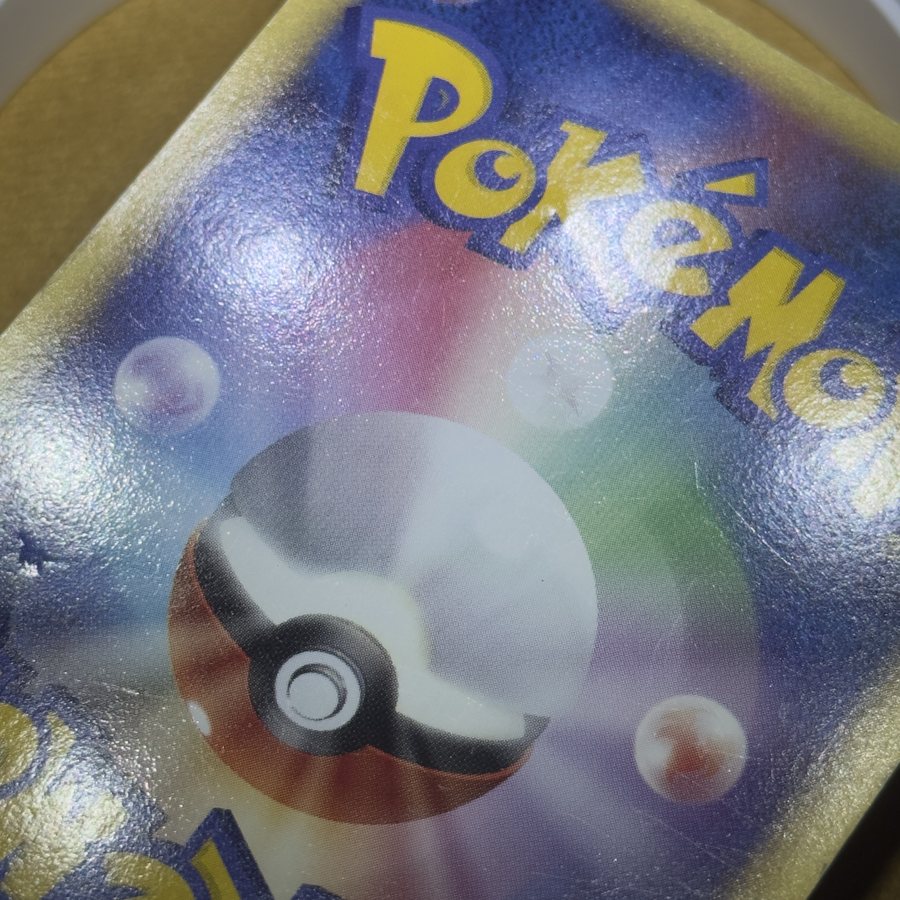 Japanese Pokémon card back before dent & in-dent removal