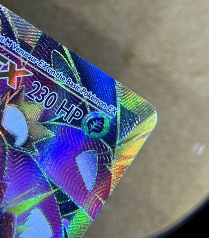 Same card after lifted edge repair by Pokejem