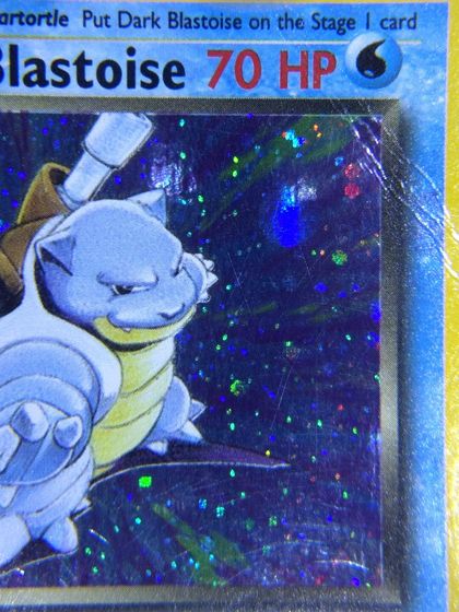 Same card after scratch & dent removal by Pokejem