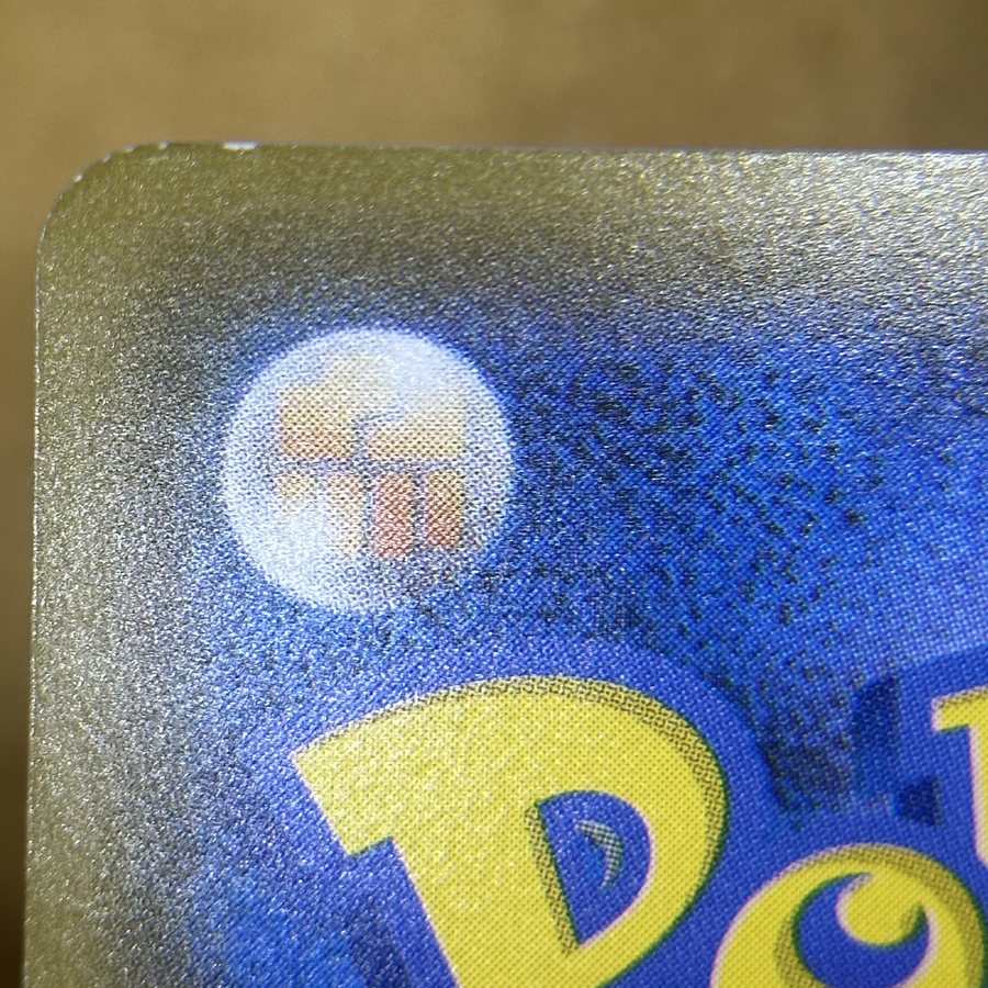 Japanese Pokémon card before edge whitening repair
